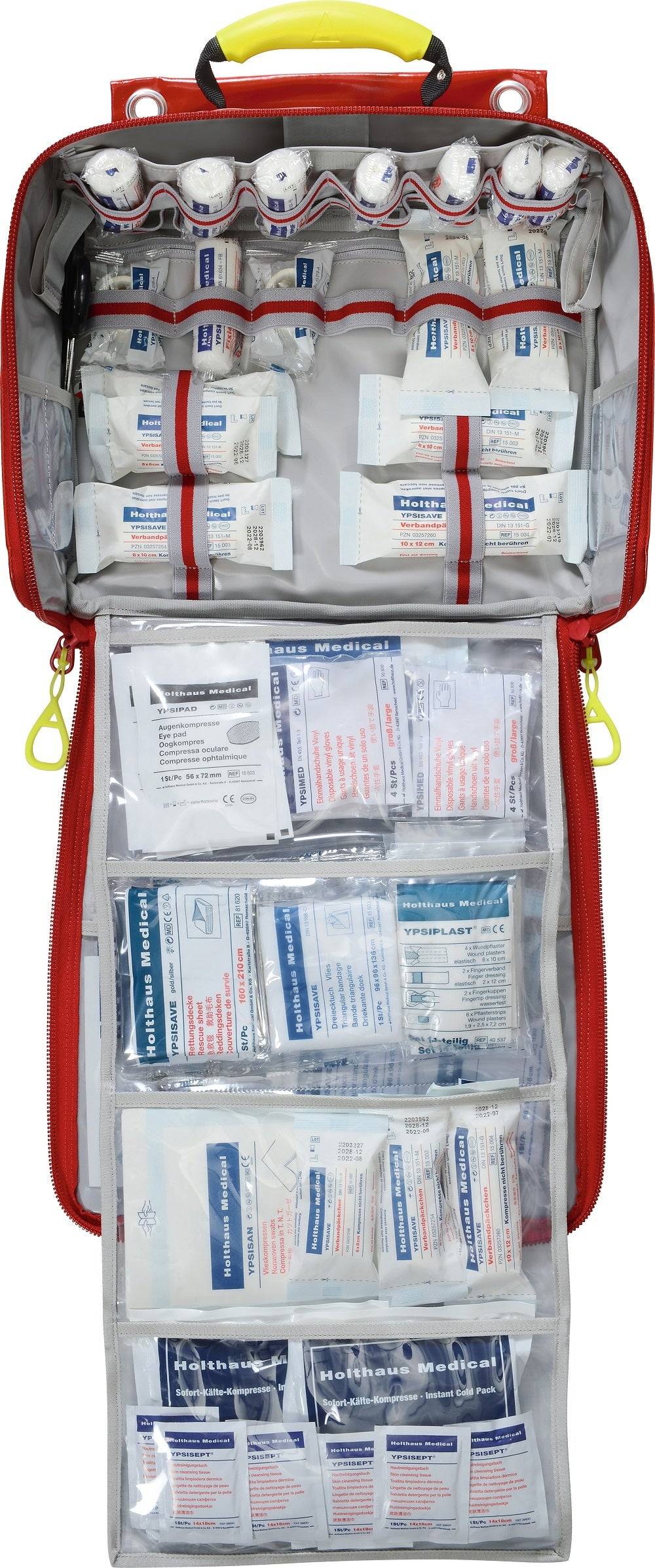 Geöffnete PARAMEDIC Wandtasche mit klar strukturierter Innenaufteilung und Erste-Hilfe-Inhalt nach DIN 13169 – sofort einsatzbereit im Notfall.