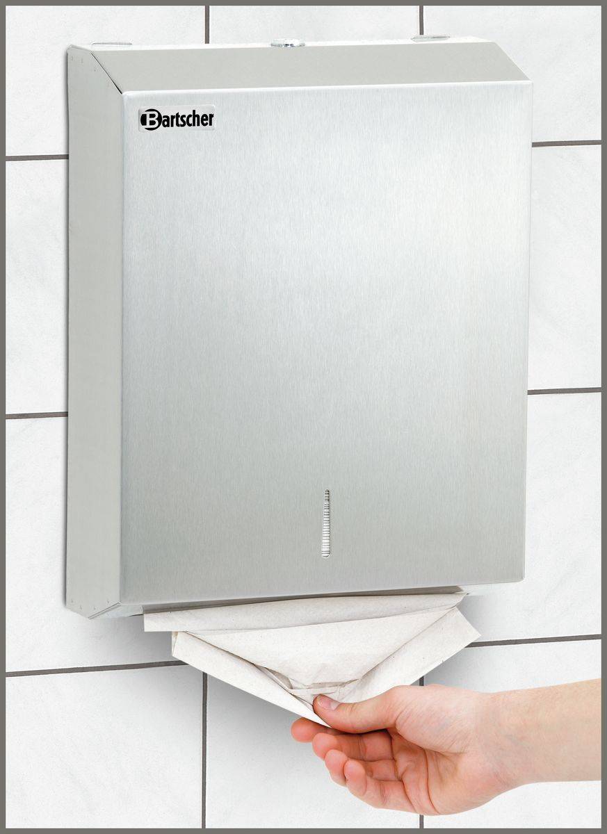 Falthandtuchspender ILZF10 an der Wand montiert mit entnehmendem Papierhandtuch, ideal für hygienische Waschraumlösungen in Unternehmen.